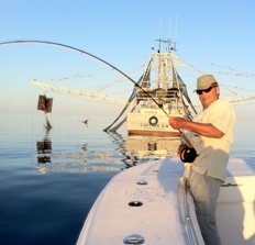 Tuna fishing behind the shrimp boats